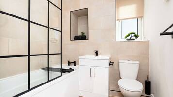 Shower, hair dryer, towels, shampoo