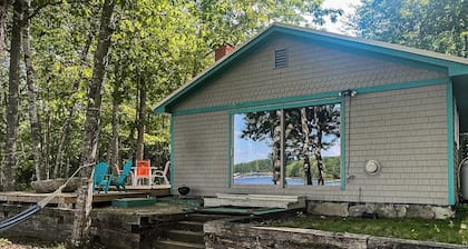 Cozy lakefront cabin with amazing views, deck, firepit, & water access