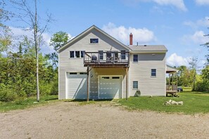 Exterior - Modern farmhouse with deck, firepit, & balcony (Northport)