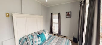 Charming upstairs duplex with fast WiFi, partial AC, & walkable location