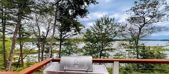 Luxurious waterfront home with deck, firepit, hot tub, fireplace, & pool table