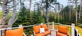 Idyllic waterfront home with furnished deck, grill, sweeping views & private W/D