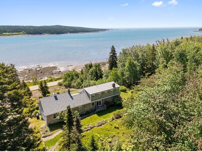 Dog-friendly oceanfront home with private shorefront, two fireplaces, & firepit