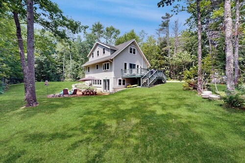 Sunny, lakefront home on South Pond with private dock, great deck & firepit