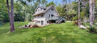 Sunny, lakefront home on South Pond with private dock, great deck & firepit