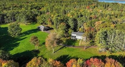 Renovated farmhouse on an acreage with grill, four-bedrooms, & W/D - river views