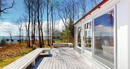 Oceanfront retreat with sunrise views, screened porch, & deck