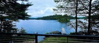Spacious Lakefront Home with a Sandy Beach, Kayaks, and Stunning Panoramic Views