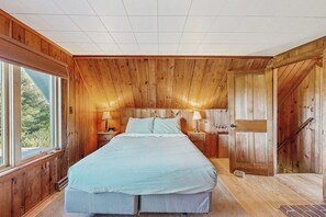 Desk, iron/ironing board, bed sheets