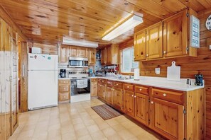 Fridge, microwave, oven, stovetop - Peaceful Lakefront Escape with Outdoor Dining, Beach Access,  Deck & Firepit (Otis)