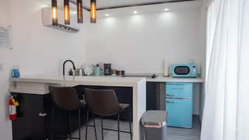 Microwave, stovetop, coffee/tea maker, cookware/dishes/utensils