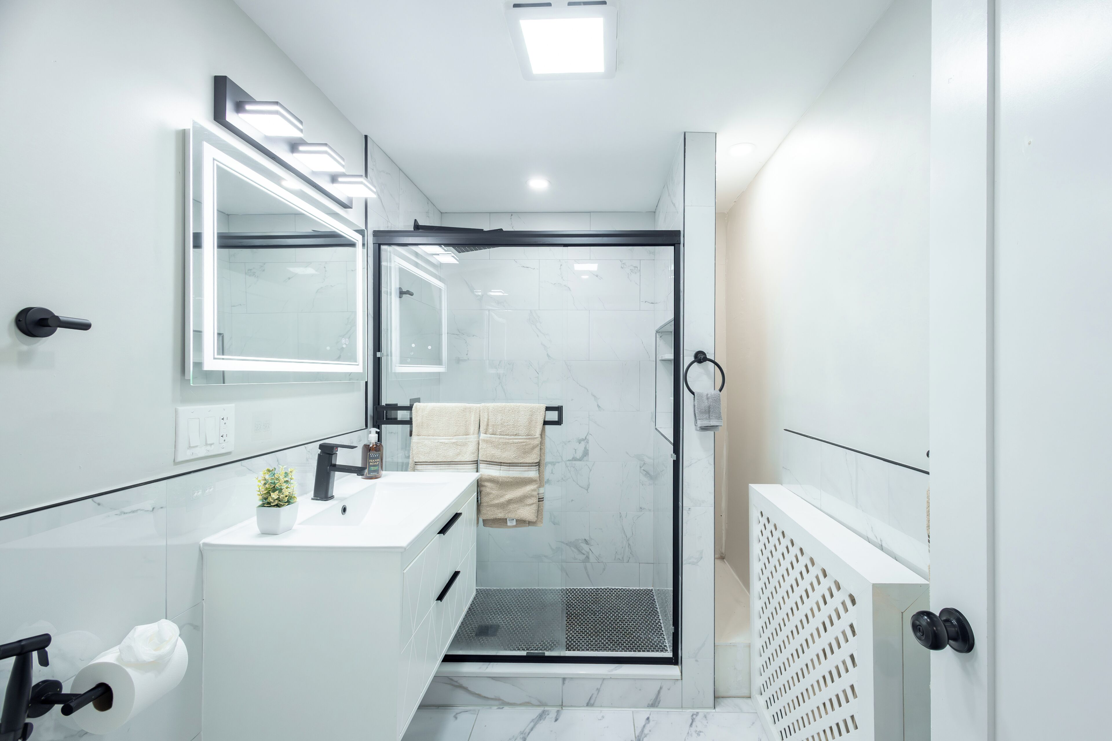 Shower, hair dryer, towels, shampoo