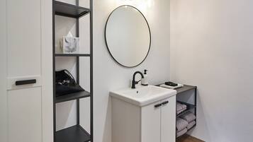 Shower, towels, soap, toilet paper