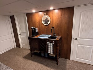 A kitchenette with a coffee machine, sink, and countertop. - Cozy 2 bedroom suite in downtown Kelowna BC (Kelowna)
