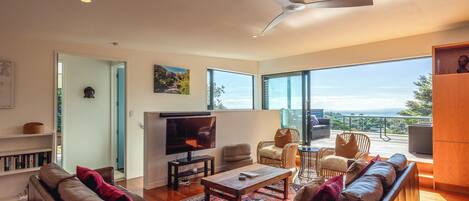 Deluxe House, Patio, Sea View | Living area | 55-inch LED TV with digital channels, smart speakers