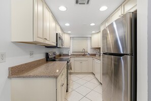 Condo, Multiple Beds (Oasis 21) | Private kitchen - Oasis 21 (Daytona Beach)