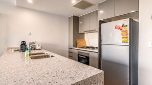 Fridge, microwave, oven, stovetop - Olympic Park 2BR/2BA | Skyline View + Parking (Sydney Olympic Park)