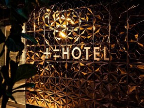 A geometric wall design with the text 'HOTEL' prominently displayed. - JYUNIHOTEL (Fukuoka)