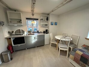 Family Studio, Patio, Courtyard View | Private kitchen | Fridge, microwave, coffee/tea maker, electric kettle