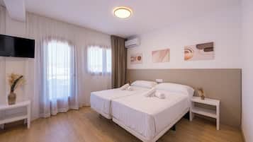 Basic Quadruple Room, Balcony | In-room safe, free WiFi