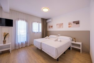 Basic Quadruple Room, Balcony | In-room safe, free WiFi