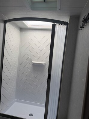 Shower, towels, soap, toilet paper