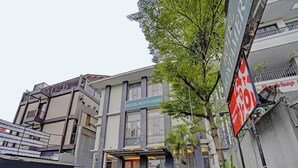A hotel named 'HOTEL MONTEAMERI' with a modern facade, a covered entrance, and a landscaped area with potted plants. - Luxury Deluxe DBL Retreat W/ Free Wifi and Parking (Bandung)