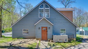 A small, single-story building with a gabled roof, a central door, and a small porch area. - Family Home in Monticello! Water-View Retreat (Monticello)