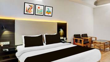 Desk, iron/ironing board, bed sheets
