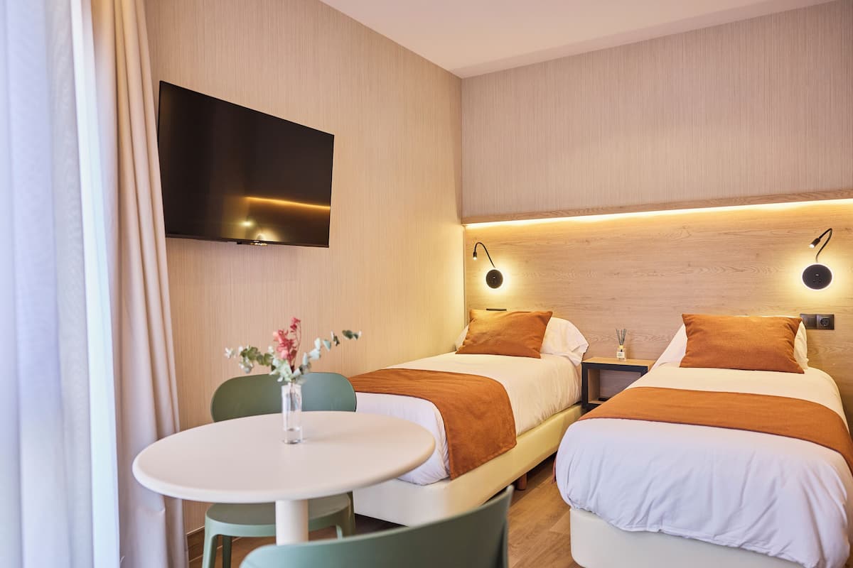 Twin Room | Premium bedding, down comforters, free minibar items, desk