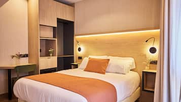Premium bedding, down comforters, free minibar items, desk