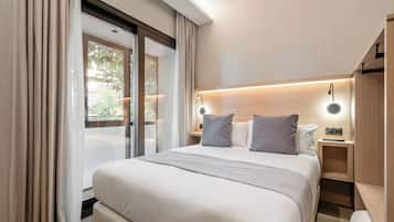 Luxe beddengoed, donsdekens, een minibar met enkele gratis items
