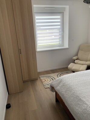 1 bedroom, desk, iron/ironing board, travel crib