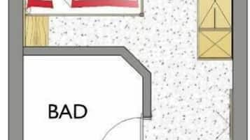 Plano de planta que muestra una cocina, comedor y dos habitaciones, identificadas como 'BAD' y 'WC'.