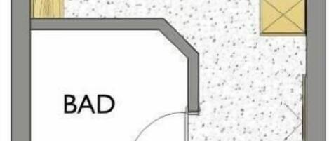 A floor plan with a kitchen, dining area, and two bedrooms labeled 'BAD' and 'WC'.