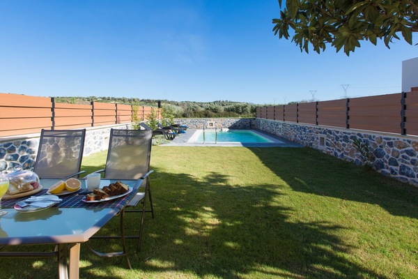 Private swimming pool area and outdoor dining area