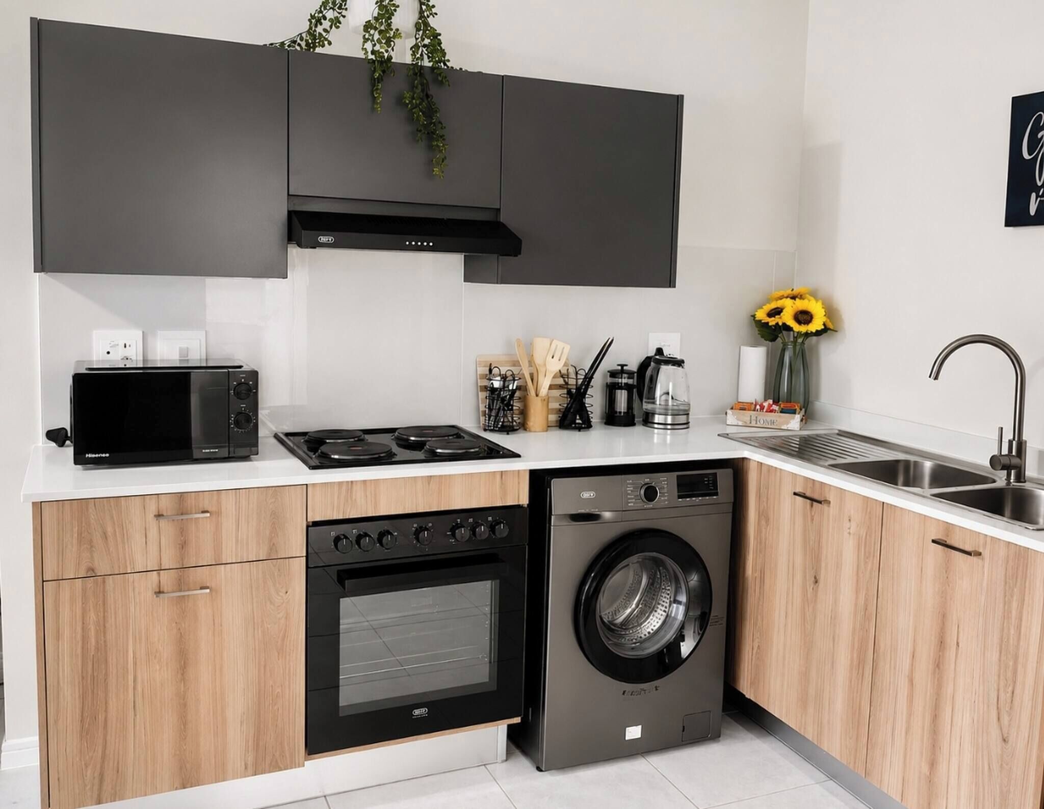 A modern kitchen with a built-in oven, microwave, stove, and dishwasher.