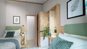 Een slaapkamer met twee bedden, een houten garderobe, een radiator en een kunstwerk met een blad in een lijst.