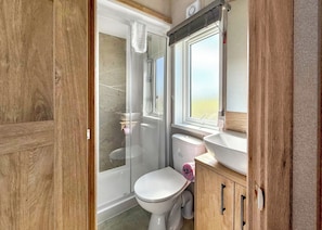 A bathroom with a shower, toilet, and sink. - Exclusive Lodge 4 bed HT Pet (Great Yarmouth)