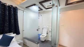 Family Studio Suite, Balcony, City View | Bathroom | Shower, slippers, towels, soap