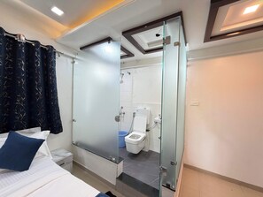 Family Studio Suite, Balcony, City View | Bathroom | Shower, slippers, towels, soap - Hotel lotus Guest House (Pune)