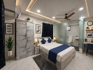 Family Studio Suite, Balcony, City View | In-room safe, desk, laptop workspace, soundproofing - Hotel lotus Guest House (Pune)