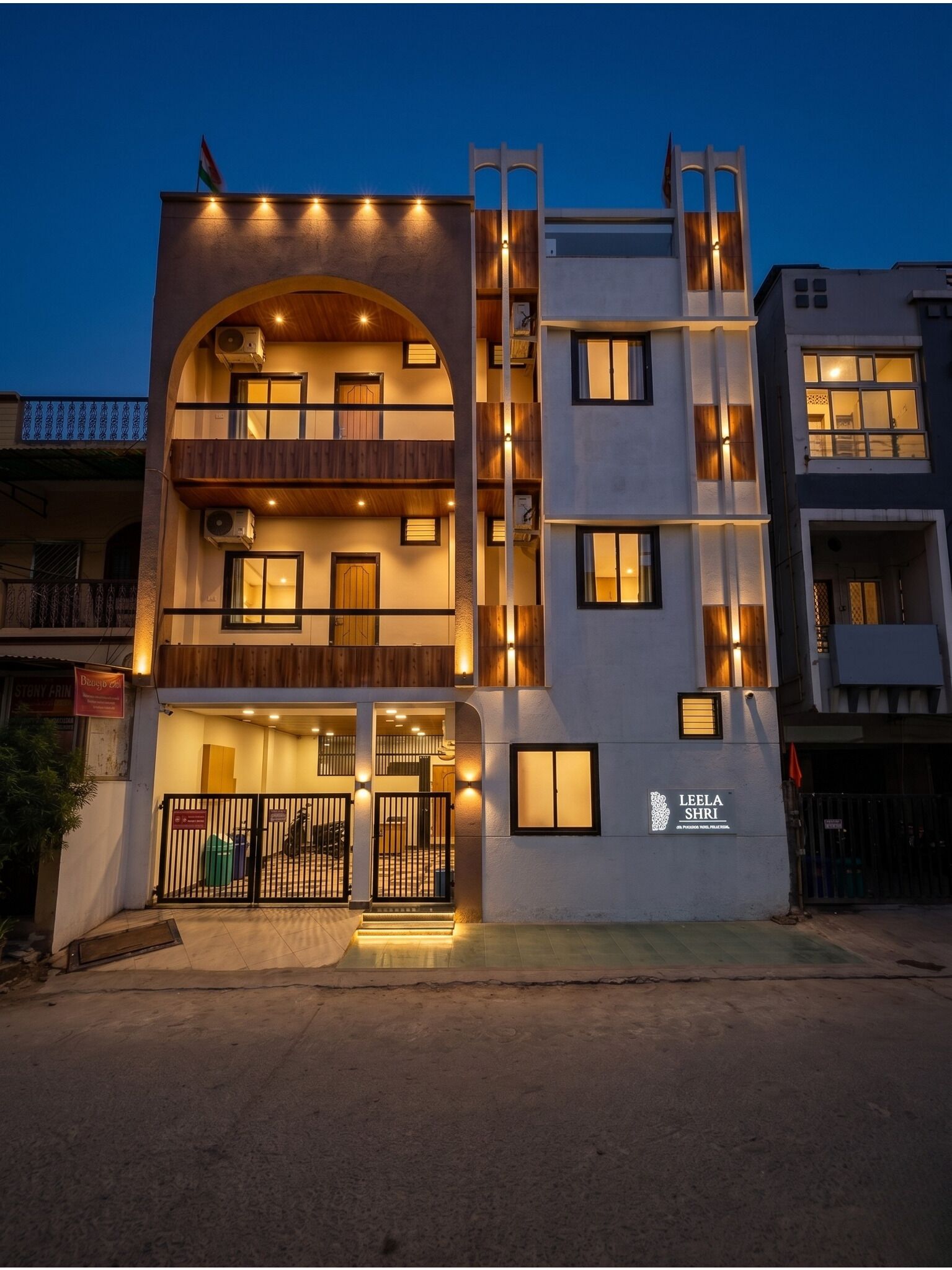A multi-story building with a sign for 'LEE LA SHRI' at the entrance.