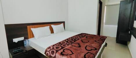 Deluxe Double Room, City View | In-room safe, desk, laptop workspace, iron/ironing board
