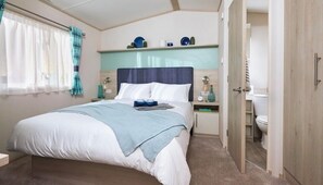 Room - All the home comforts of a Classic Holiday Home, plus a larger decking. Two bedroom holiday home sleeping 4 people; 1 double & 1 twin room. Lounge, dining table and chairs, fully equipped kitchen, shower room. (West Lulworth)