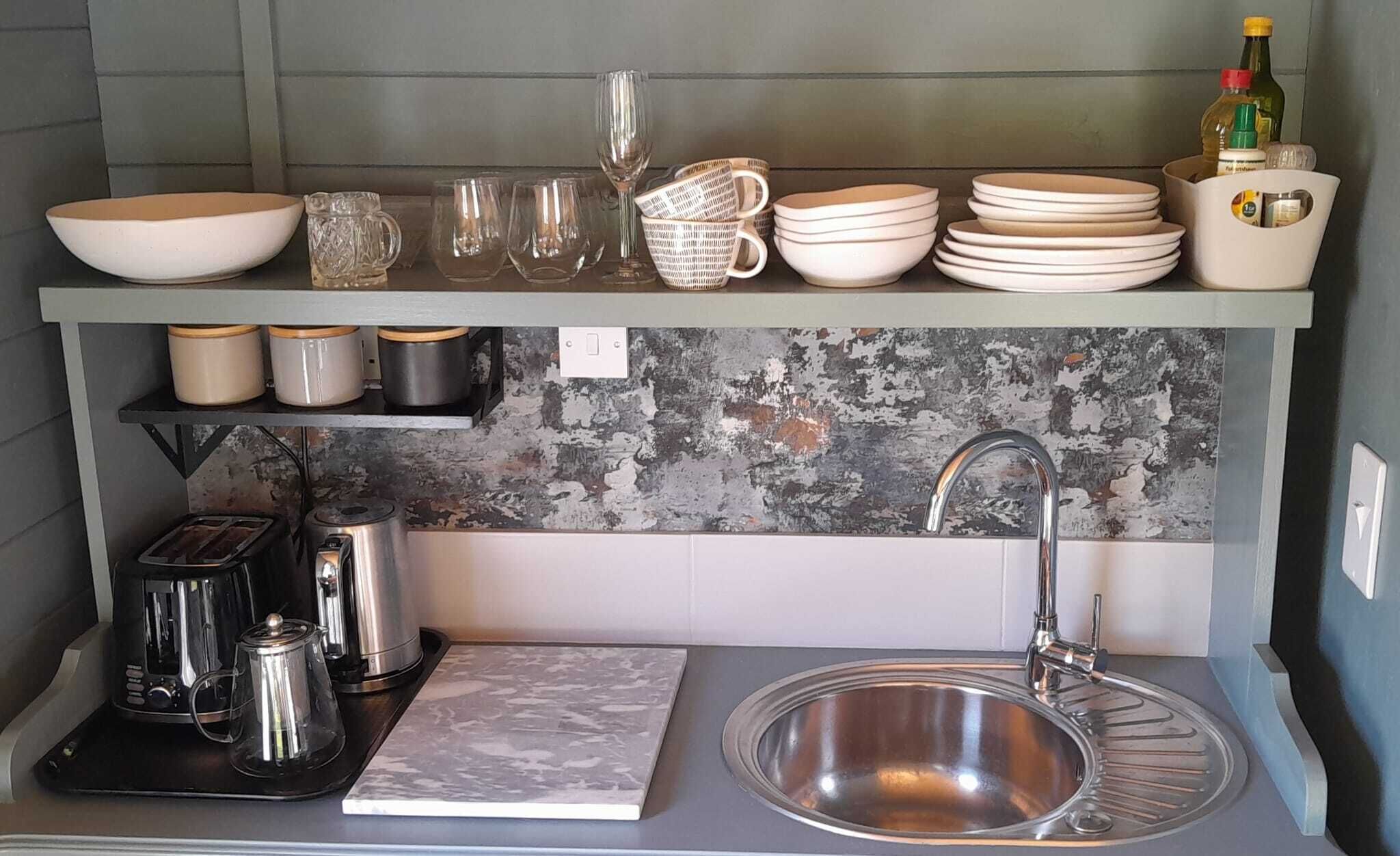 Kitchenette with fridge, kettle, toaster and a selection of teas 