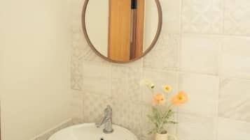 Basic Studio, Balcony, Mountain View | Bathroom | Hydromassage showerhead, designer toiletries, hair dryer, bathrobes