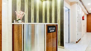 A reception desk with a sign reading 'HOTEL & Spa Services.' - Deluxe With Twin Bed BK International (Kolkata)