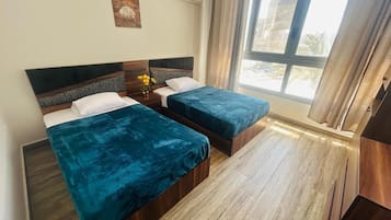 Deluxe Apartment, Balcony, City View | Laptop workspace, iron/ironing board, free WiFi