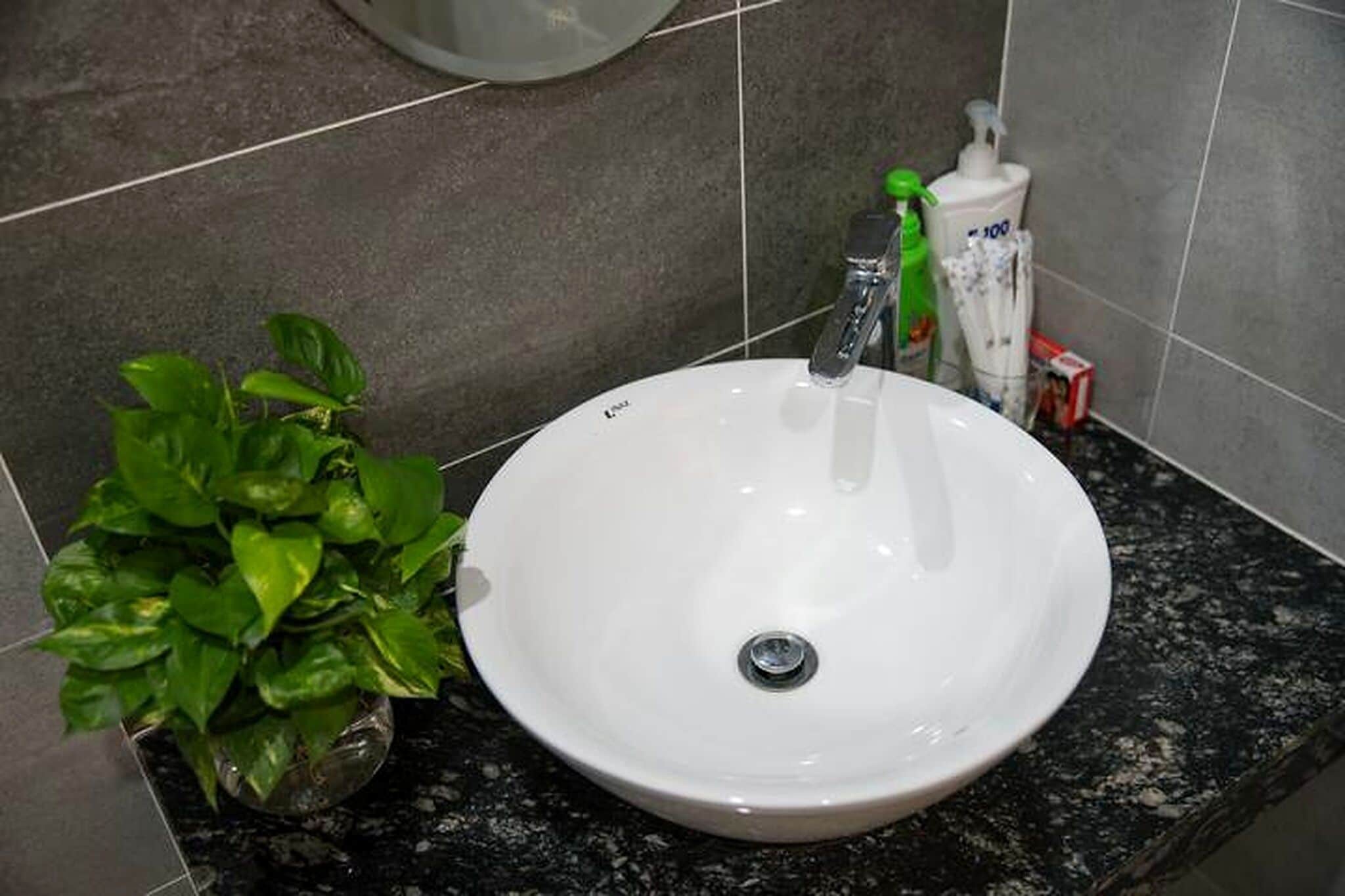 Shower, hair dryer, slippers, towels